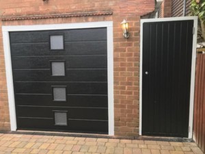 insulated sectional garage door with side entrance 1