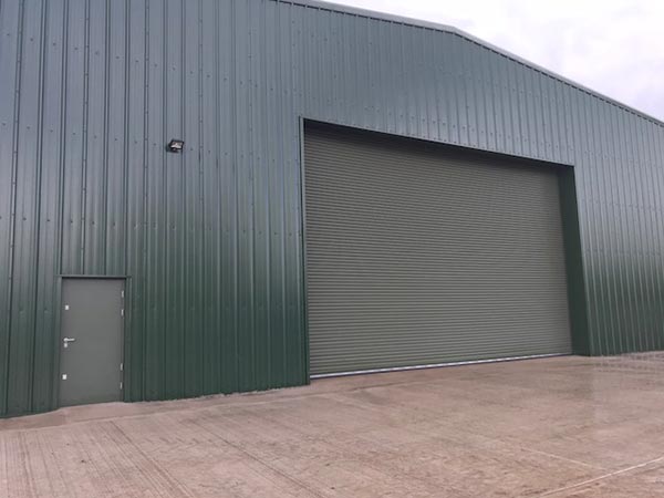 large bespoke hanger roller shutter and personnel access door