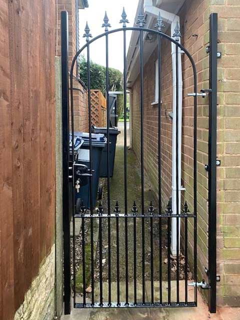 solid-steel garden gate to front