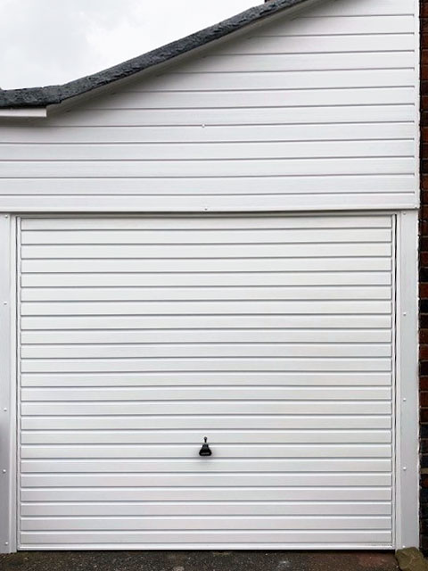 Horizon garage door with cladding above
