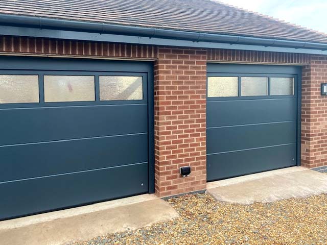 Glazed sectional garage doors