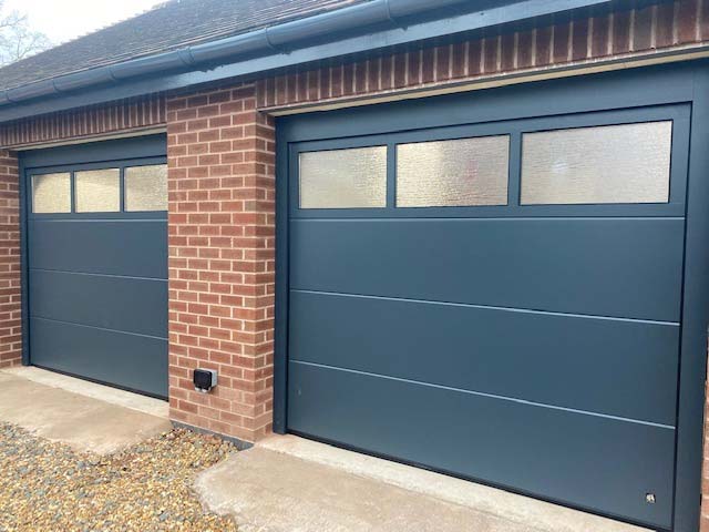 Glazed sectional garage doors