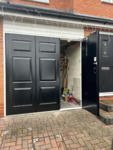 Bi folding insulated side hinged garage doors - single panel open