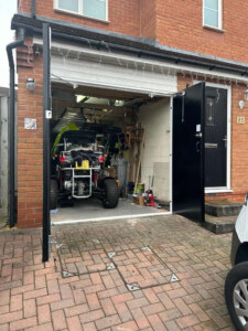 Bi folding insulated side hinged garage doors open